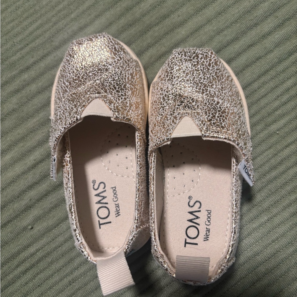 TOMS Shimmering Gold toddler Shoe